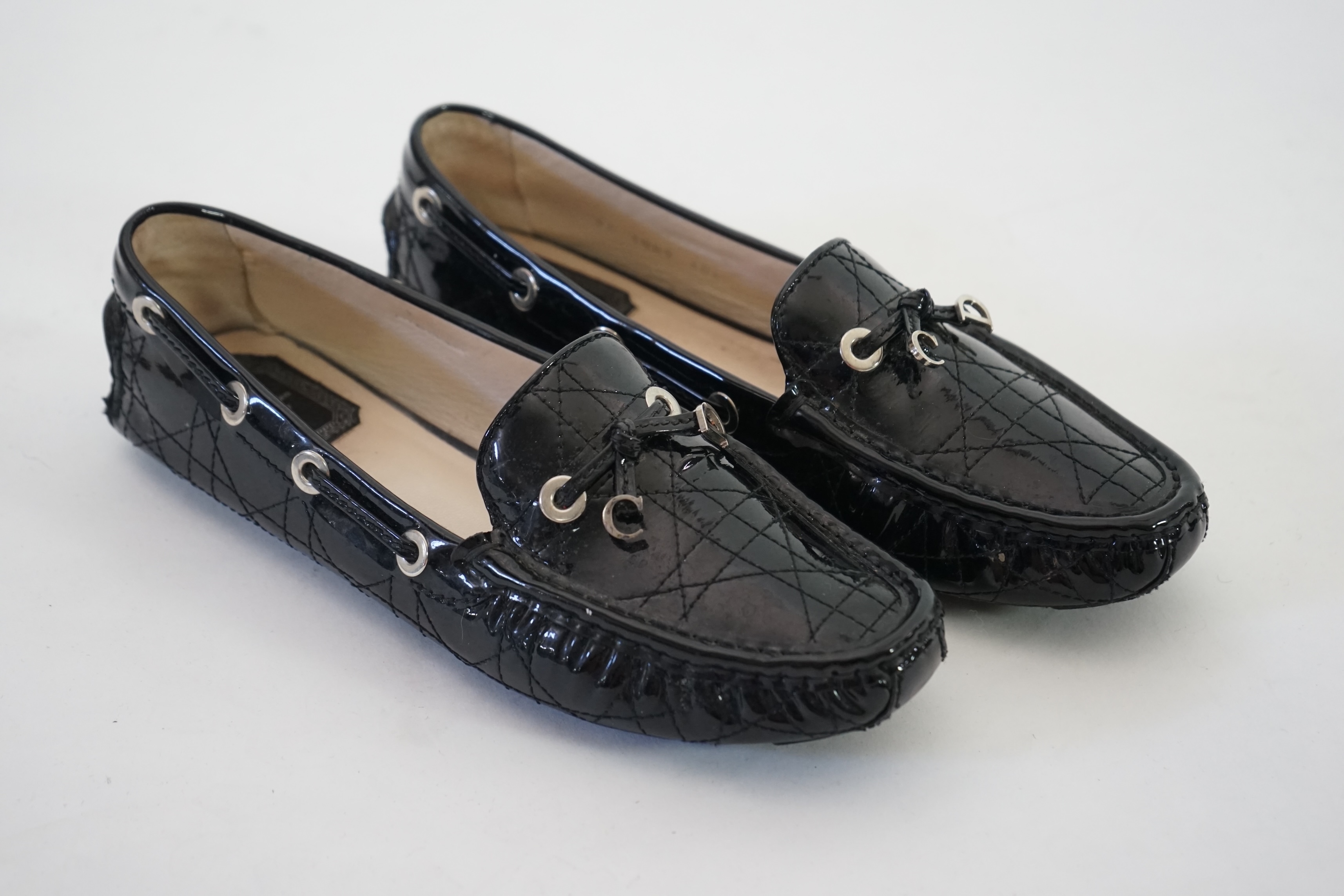 A pair of Christian Dior black patient leather lady's driving shoes with dustbag and in original box. Size 38.5. Proceeds to Happy Paws Puppy Rescue